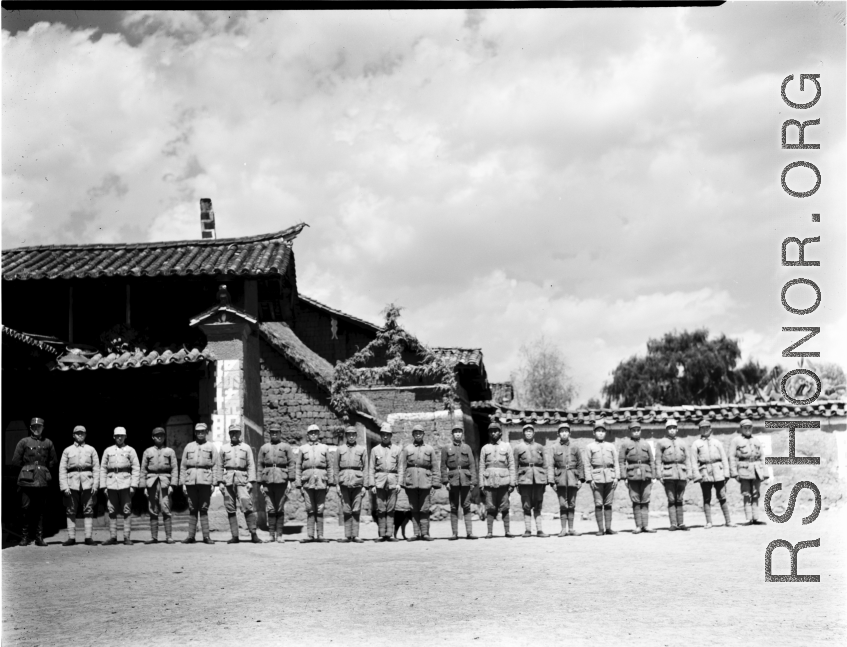 Chinese soldiers pose in a row. In Yunnan, China, during WWII.