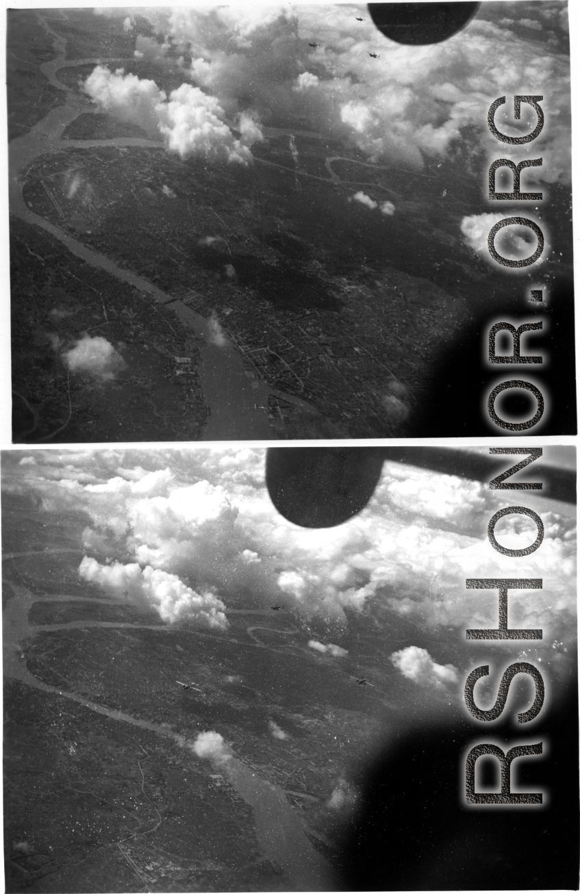 Aerial view of B-25s over a city--possibly a bombing target--likely over French Indochina (Vietnam) or SW China. During WWII.