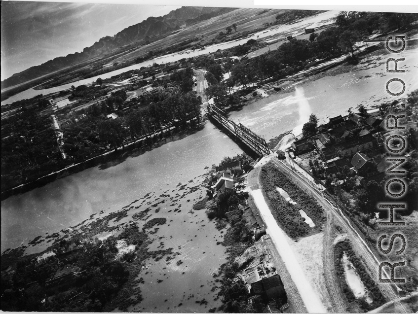 Bombing of Phy Ly railway bridge in French Indochina (Vietnam), during WWII. In northern Vietnam, and along a critical rail route used by the Japanese.