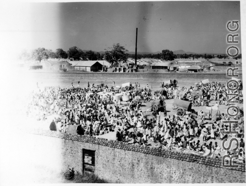 Busy market scene.  Scenes in India witnessed by American GIs during WWII. For many Americans of that era, with their limited experience traveling, the everyday sights and sounds overseas were new, intriguing, and photo worthy.