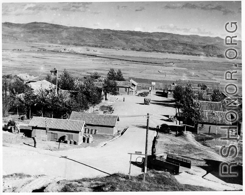 View of the American base at Chanyi, in Yunnan, China, during WWII. Note the basketball court and people on it.