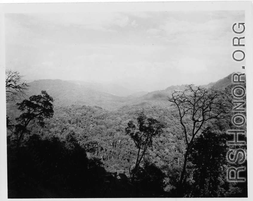 Densely forested hills in Burma, just waiting for the axe.  During WWII.  797th Engineer Forestry Company.