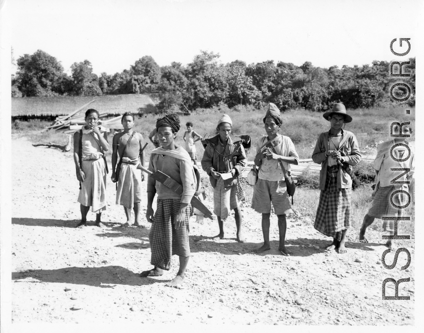 Kachin men on road in Burma.  Near the 797th Engineer Forestry Company.  During WWII.