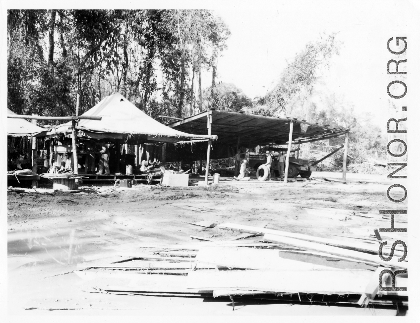 797th Engineer Forestry Company e truck repair and machine shop at camp in Burma.  During WWII.
