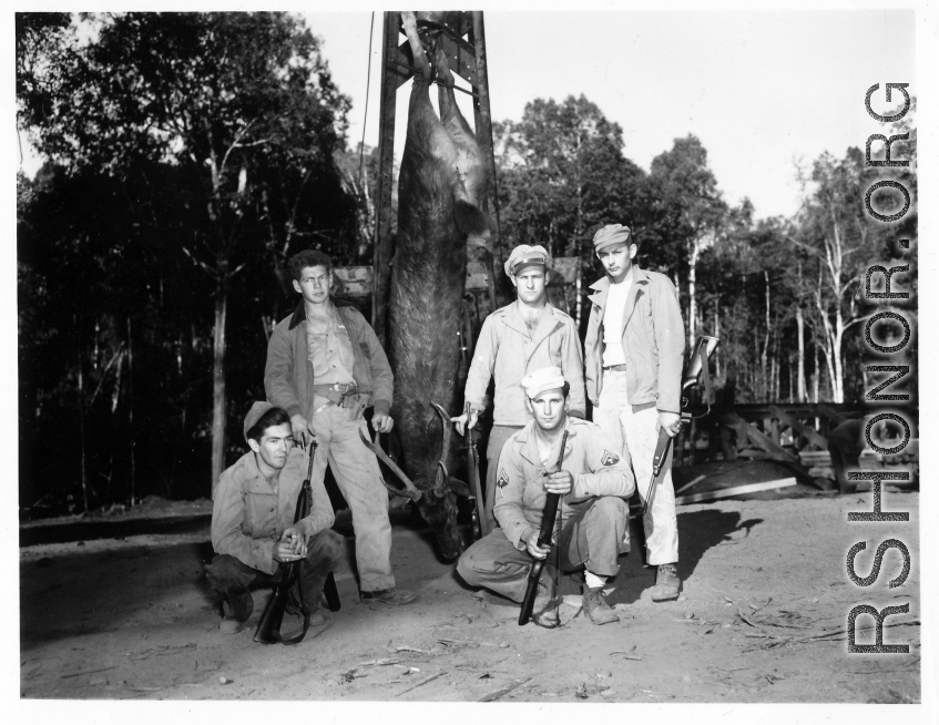 Engineers of the 797th Engineer Forestry Company pose with their catch after a round of huntin' deer in Burma.  During WWII.