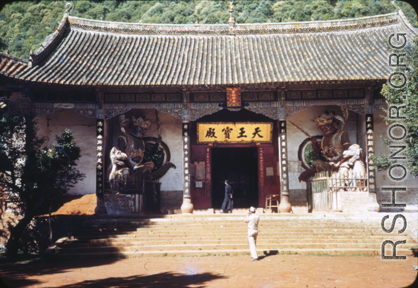 GI taking a picture a the entrance to a chamber (天王宝殿）in the Huating Temple (华亭寺), not far from Kunming, China. During WWII.