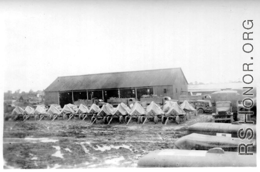 Canvas-shrouded anti-aircraft guns in Burma or India. 2005th Ordnance Maintenance Company, 28th Air Depot Group, WWII.