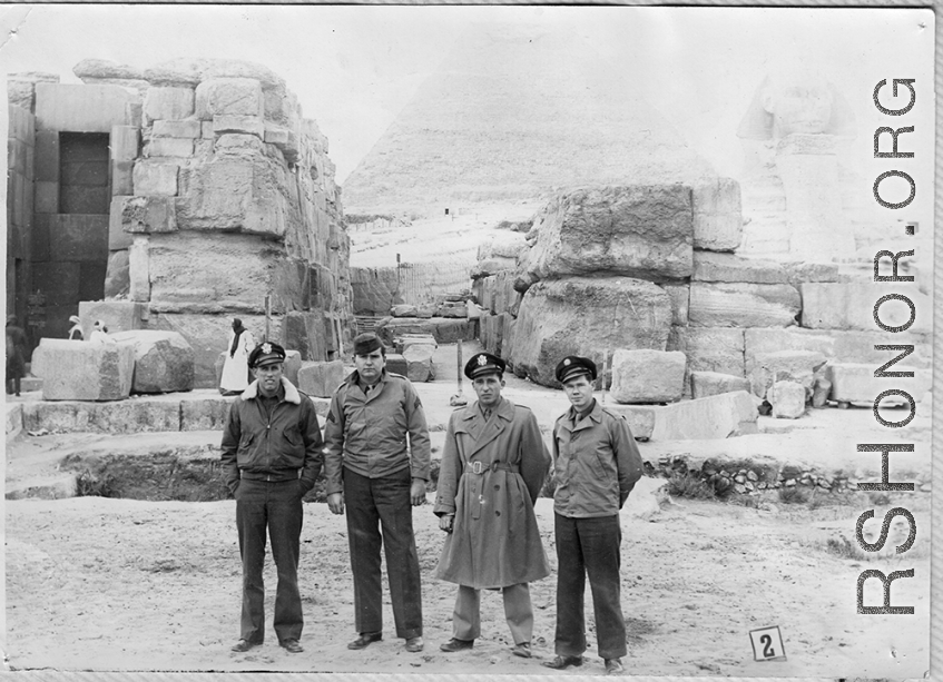 Flyers pose in front of pyramid and Sphinx in Egypt while in transit during WWII. Walter Wegner, 10th Air Force, 7th Bombardment Group, 9th Bombardment Squadron, on far left.