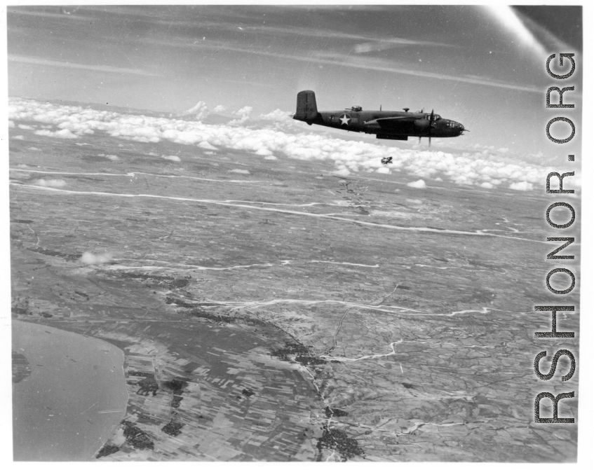 American bombing using incendiary bombs at Monywa, Burma via B-25s of the 22nd Bombardment Squadron during WWII.