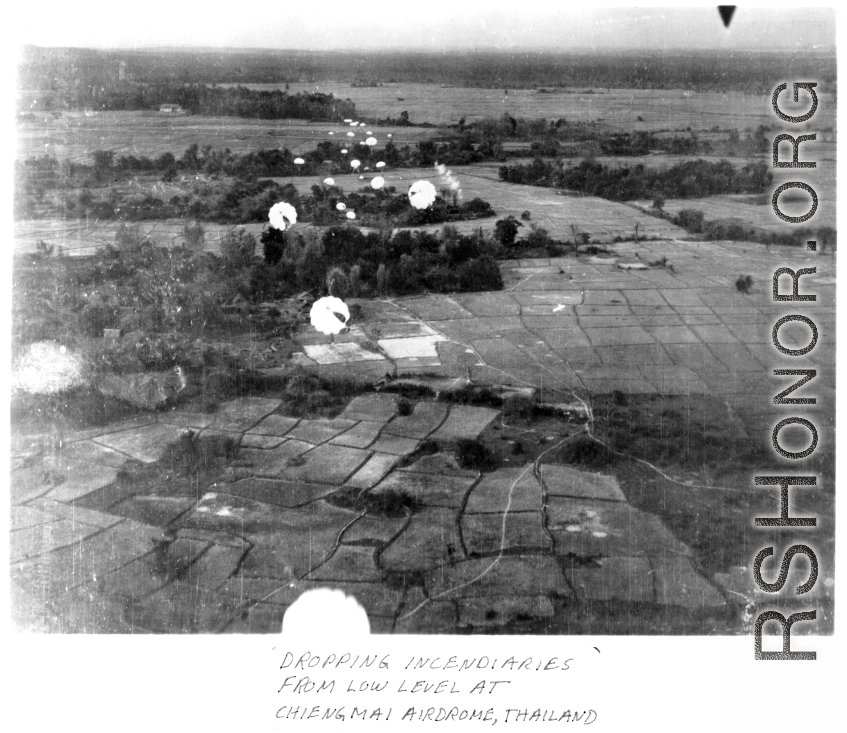 Dropping parachuted incendiaries at Chiang Mai, Thailand, air base.  22nd Bombardment Squadron.