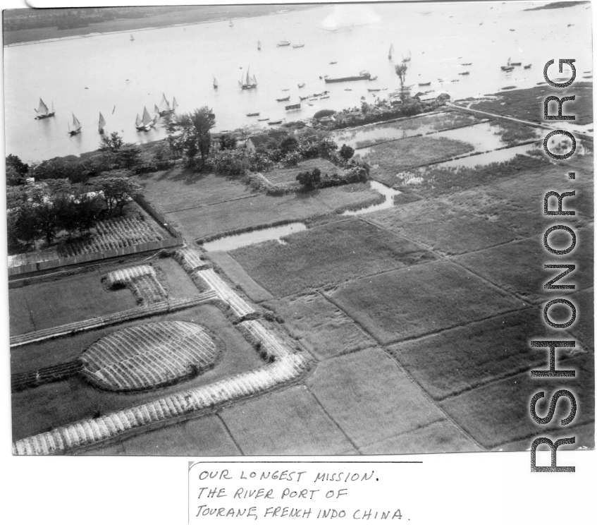 Aerial view showing boats, river, farm plots during mission to bomb Tourane, Indochina, by 22nd Bombardment Squadron in the CBI.  "Our longest mission. The river port of Tourane, French Indochina."