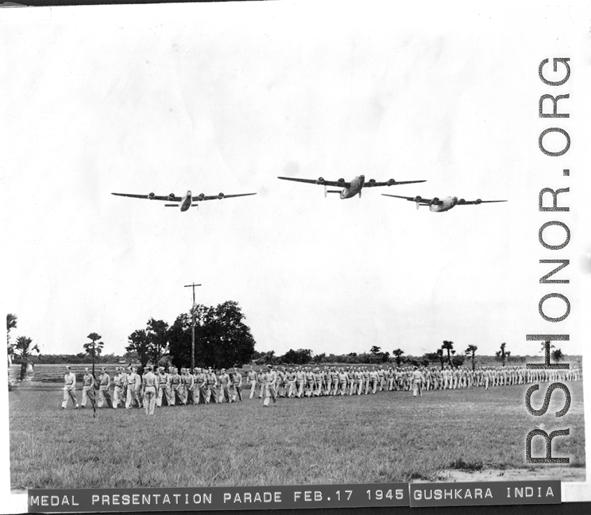 Medal presentation ceremony with B-24/F-7 flyover on February 17, 1945, in Gushkara, India.