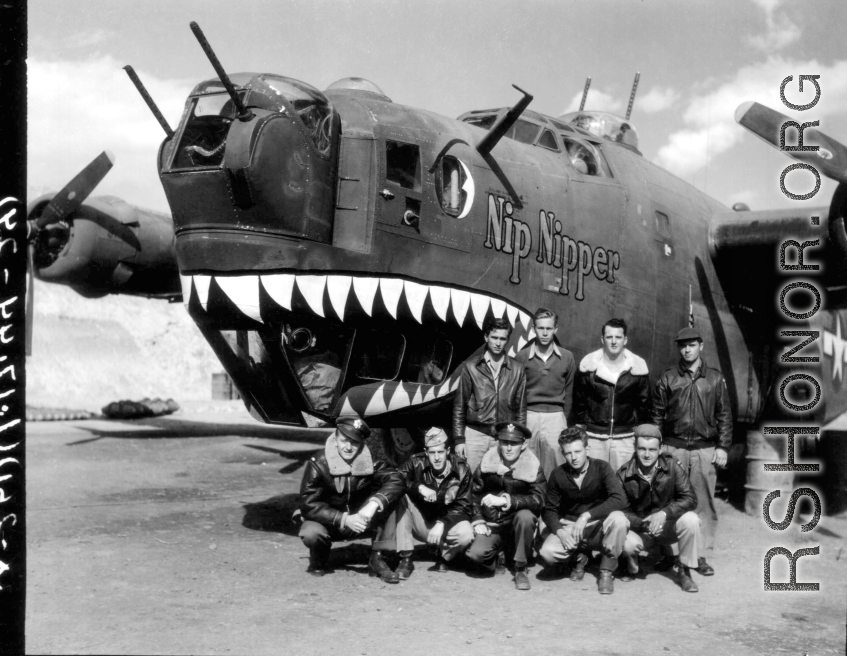A 373rd Bombardment Squadron (308th Bm Grp) crew poses at the nose of 'Nip Nipper', a B-24D1, serial #42-72837, probably in a revetment at Yangkai, early in 1944.  Image from U. S. Government official sources.