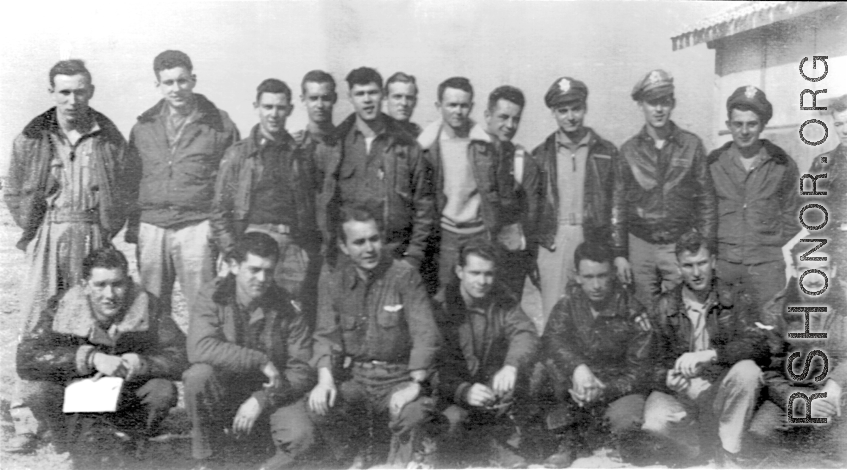 American flyers of the 528th Fighter Squadron pose in a group, probably in China. During WWII.