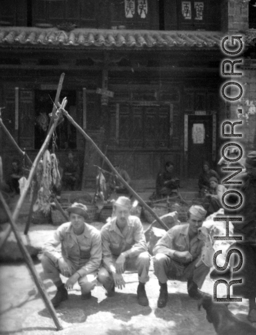 GIs in a market in Luliang, China, during WWII. Soldier in the middle is "Nelson."  From the collection of David Axelrod.