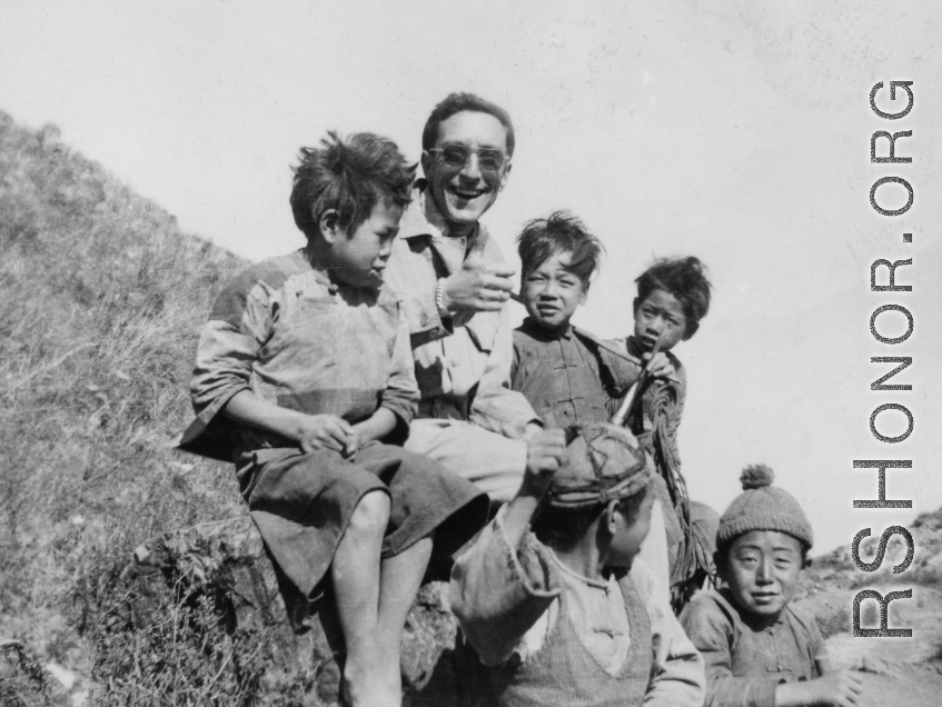 An American GI with Chinese kids in SW China during WWII.  From the collection of David Axelrod.