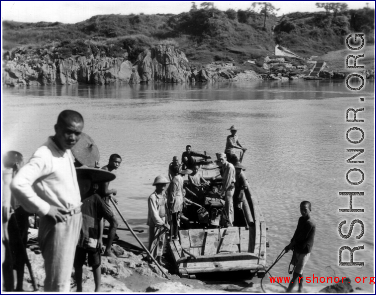 Photographer Pfc J.C. Bowermaster crossing a river in Guangxi province, near Liuzhou city.