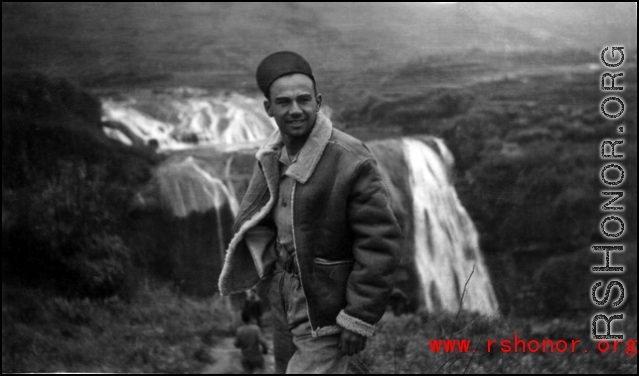 Jose Martinez, airplane mechanic with the 396th, standing in front of the Huangguoshu waterfall in Guizhou (Kweichow) province, China.   Image courtesy of Elmer Bukey.
