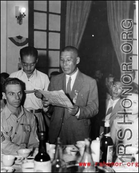 A Chinese VIP reads a speech at a banquet in China during WWII.