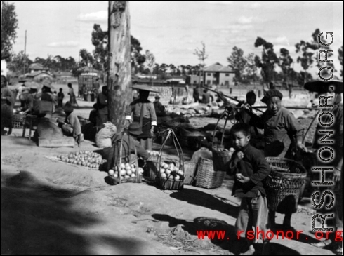 A roadside produce market in China during WWII.