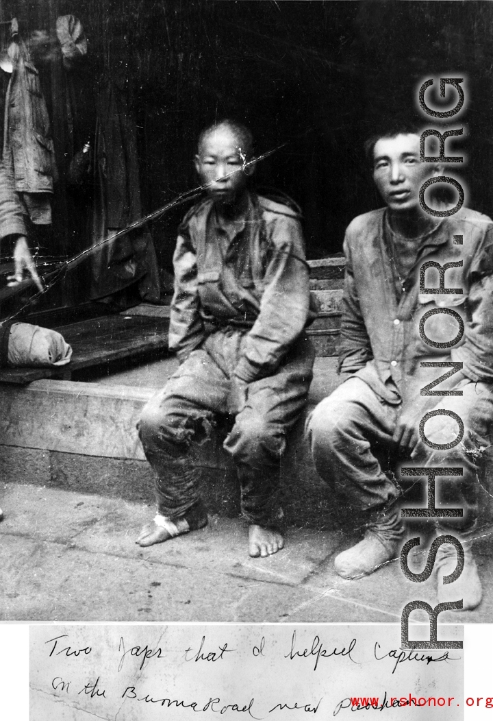 Two Japanese POWs caught on the Burma Road, near Baoshan. During WWII.