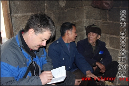 Images from January 14, 2008 visit to a WWII US crash site at Bamo township, in Tian\'e county, Guangxi province.     Patrick LUCAS interviewing elders in the village.  Mr. MA, 95 years old, in this picture,  was taking part in a family wedding on the day we visited, but was gracious to talk with us anyway.