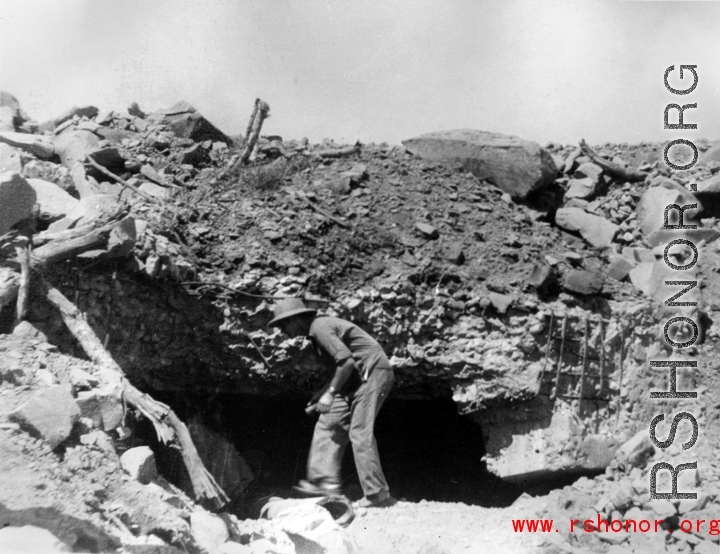 A battle-blasted bunker or pillbox in China, probably in Tengchong, during WWII.