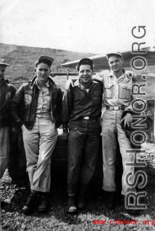 Servicemen out near the flight line loading bombs in SW China during WWII, mostly likely in Yunnan.
