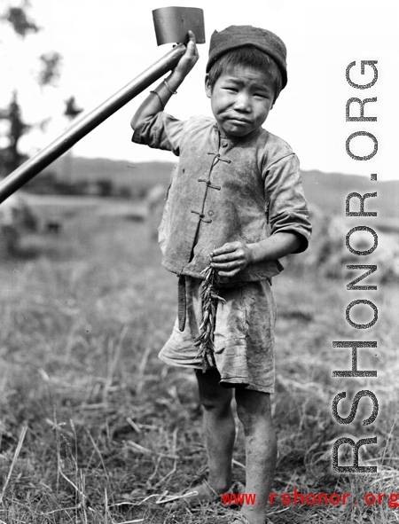 Local farm boy in Yunnan, China, during WWII.