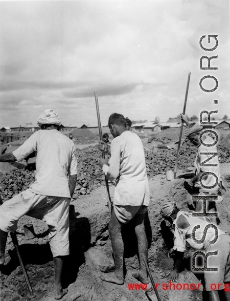 Local laborers dig in India during WWII.