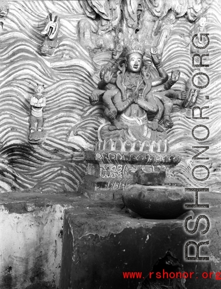 Figure in a Buddhist temple in Yunnan province, China, during WWII.