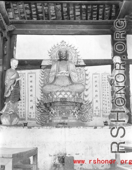 Figures in a Buddhist temple in Yunnan province, China, during WWII.