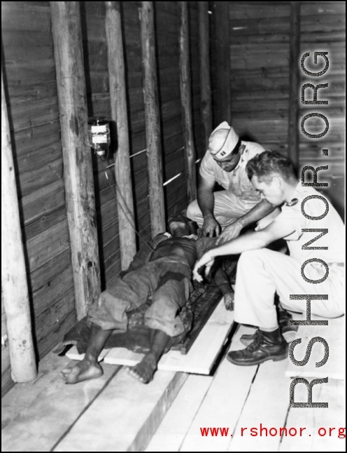 A Chinese soldier receives medical treatment from American medical personnel in the CBI during WWII.
