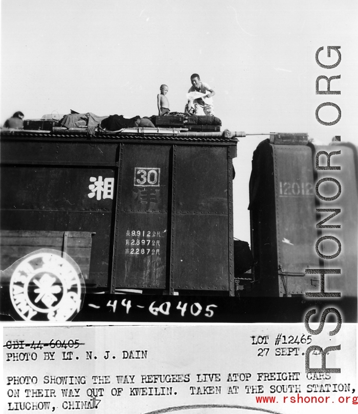 During WWII, photo showing the way refugees live atop freight cars on their way out of Kweilin (Gulin).  Take at the south station, Liuchow, China.