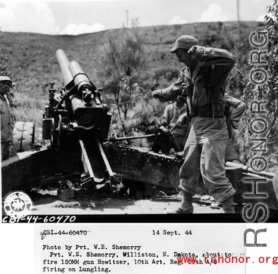 September 14, 1944  Pvt. W. E. Shemorry, Williston, N. Dakota, about to fire 150MM gun Howitzer, 10th Artiillary Regiment 11th A/G, firing on Lungling.