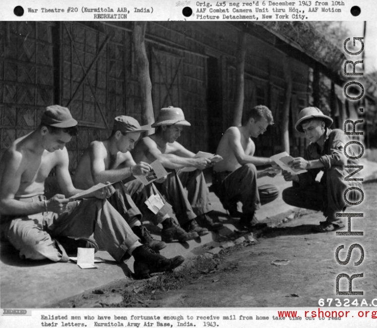Enlisted men who have been fortunate enough to receive mail from home take time out to read their letters.  Kurmitola Army Air Base, India, 1943.  In the CBI during WWII.