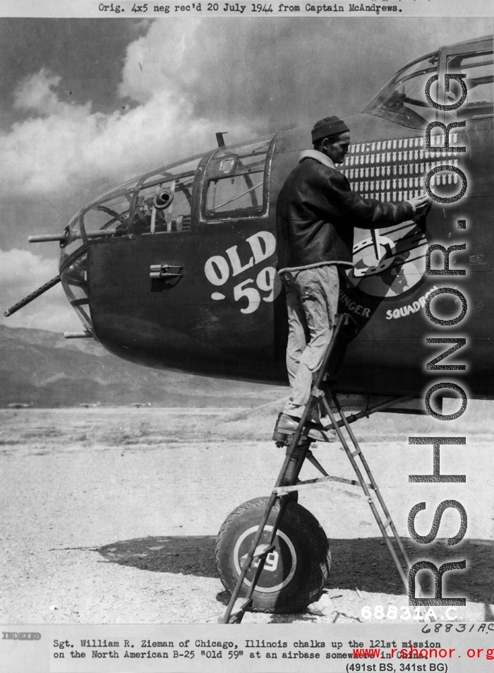 Sgt. William R. Zieman of Chicago, Illinois chalks up the 121st mission on the North American B-25 "Old 59" at an airbase somewhere in China during WWII.  341st Bomb Group, 491st Bomb Squadron.