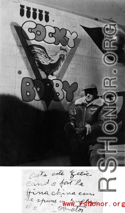 Combat Photographer Selig Seidler with the B-24 "Cocky Bobby" in the CBI.  Selig Seidler, combat photographer with the 16th Combat Camera Unit, in front of B-24 bomber #44-41427 COCKY BOBBY of the 14AF 308BG 425BS. From the collection of S/Sgt. Herbert Gross, 14AF 308BG 375BS, flight engineer/gunner on 42-73243 VITAMIN P II and other B-24s in China 1943-1944. (Shared by his son Jack Gross.)