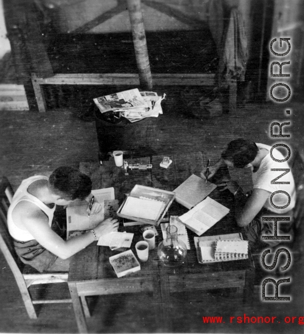 Barracks life at an American base in southwest China during WWII GIs take care of correspondence.  