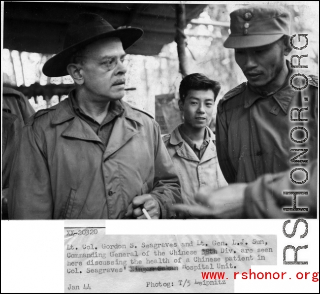 Lt. Col. Gordon S. Seagrave and Lt. Gen. L. J. Sun, Commanding General of Chinese 38th Div., are seen here discussing the health of a Chinese patient in Col. Seagrave's Ningam Sakan hospital unit. January, 1944.  Photo by T/5 Leipnitz.