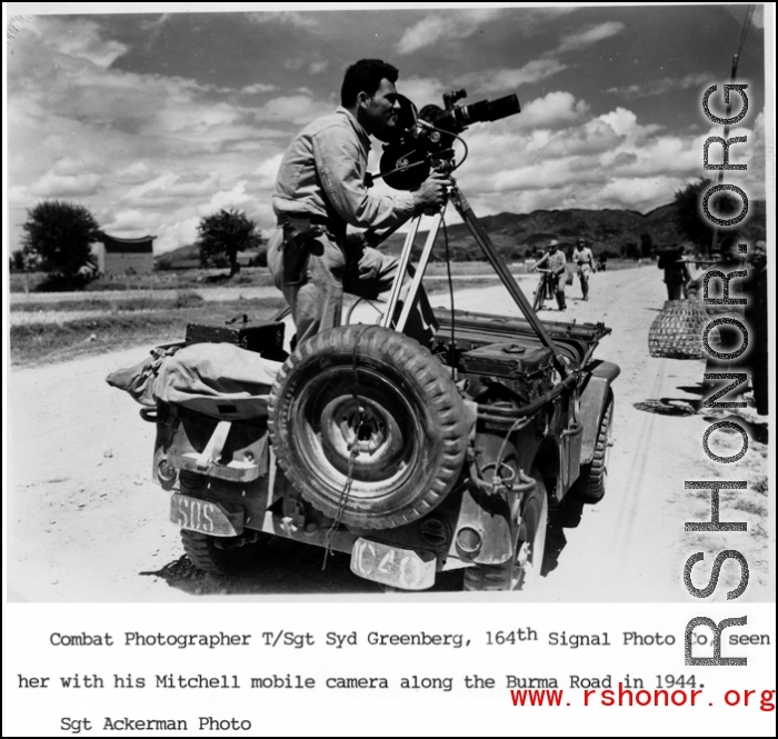 Combat Photographer T/Sgt. Syd Greenberg, 164th Signal Photographic Company, with his Mitchell mobile camera along the Burma Road in 1944. In the CBI in 1944.  Photo by Sgt. Ackerman.