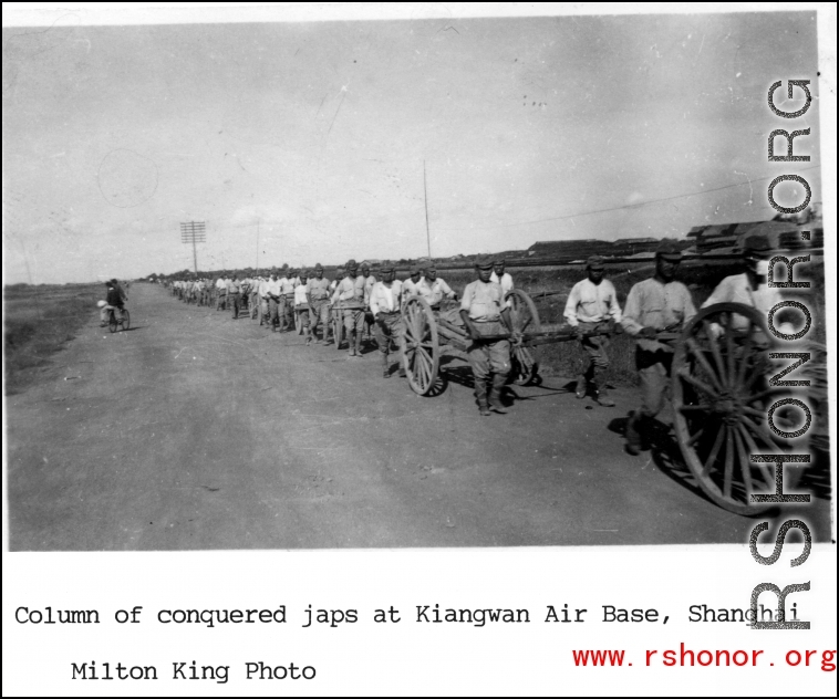 Column of conquered Japanese soldiers at Kiangwan Air Base, Shanghai.  Photo from Milton King.