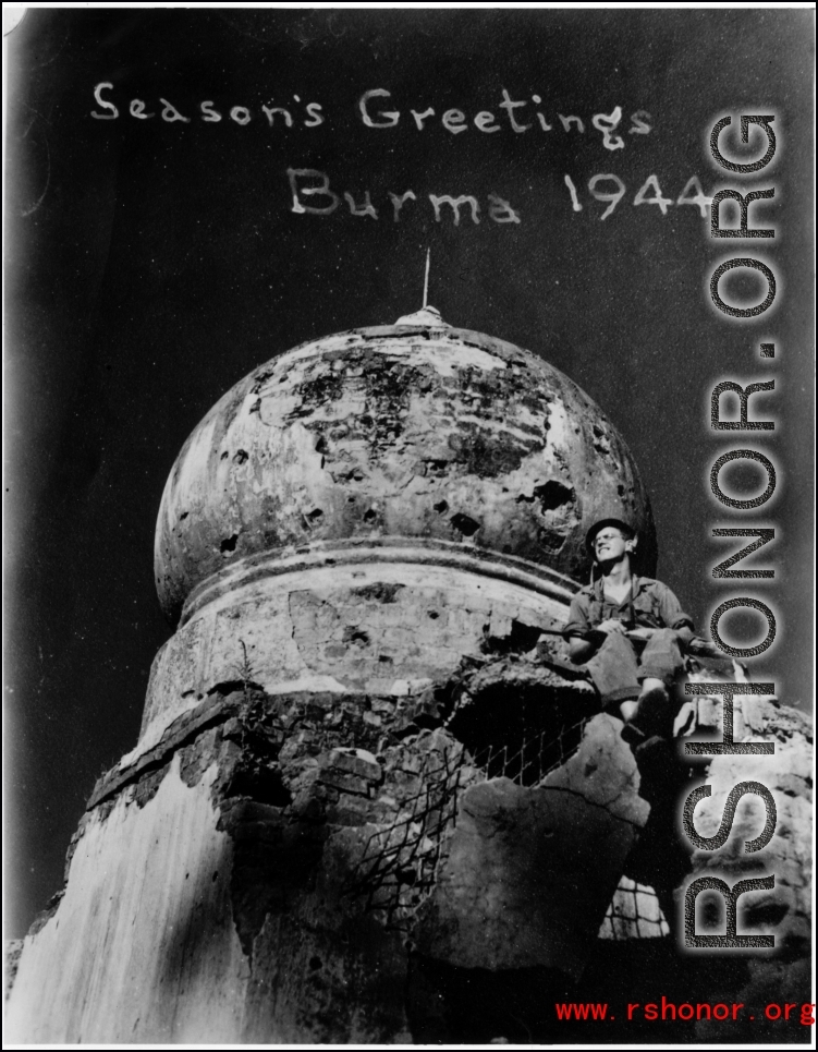 A GI's personalized season's greetings from Burma, in 1944, with a bomb damaged temple dome as background. During WWII.