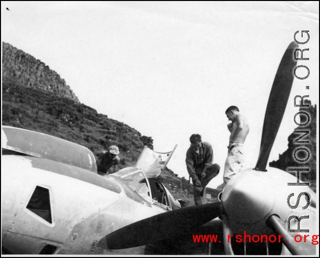 GIs work on a P-38 in Guangxi province, China, during WWII.