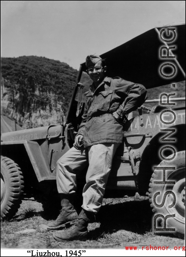 16th Combat Camera Unit photographer Hal Geer leans against jeep as he poses in Liuzhou in 1945.