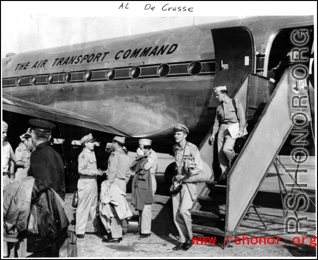 GIs depart a C-54 of the Air Transport Command (ATC) at Karachi during WWII. The 1306th Army Air Force Base Unit (306th AAFBU) provided services such as the stairs down from the plane.  The Photo from Al De Grasse.