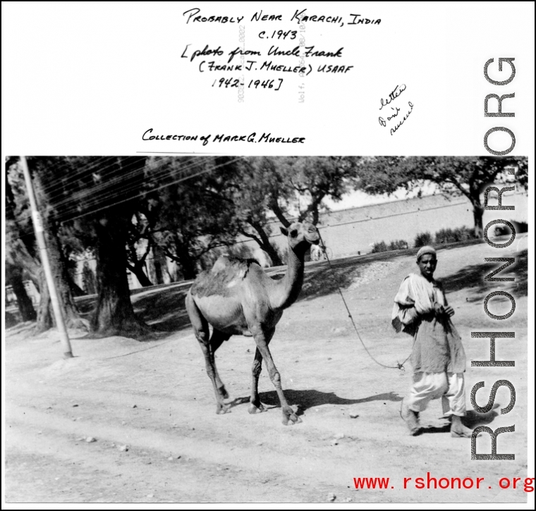 Camel and owner on street, probably near Karachi, India, 1943.  Photo by Frank J. Mueller, USAAF 1942-1946, provided by Mark G. Mueller.
