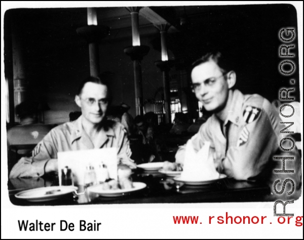 Two GIs have an elegant dinner in the CBI during WWII.  Walter De Blair.