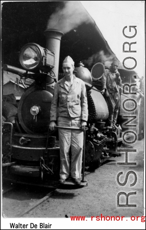 A GI rides a narrow-gauge train engine. In the CBI during WWII.  Photo from Walter De Blair.