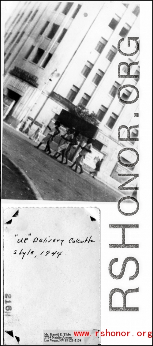 Personal delivery in Calcutta during WWII--several men carrying a large burden in 1944.  Photo from Harold E. Tibbs.